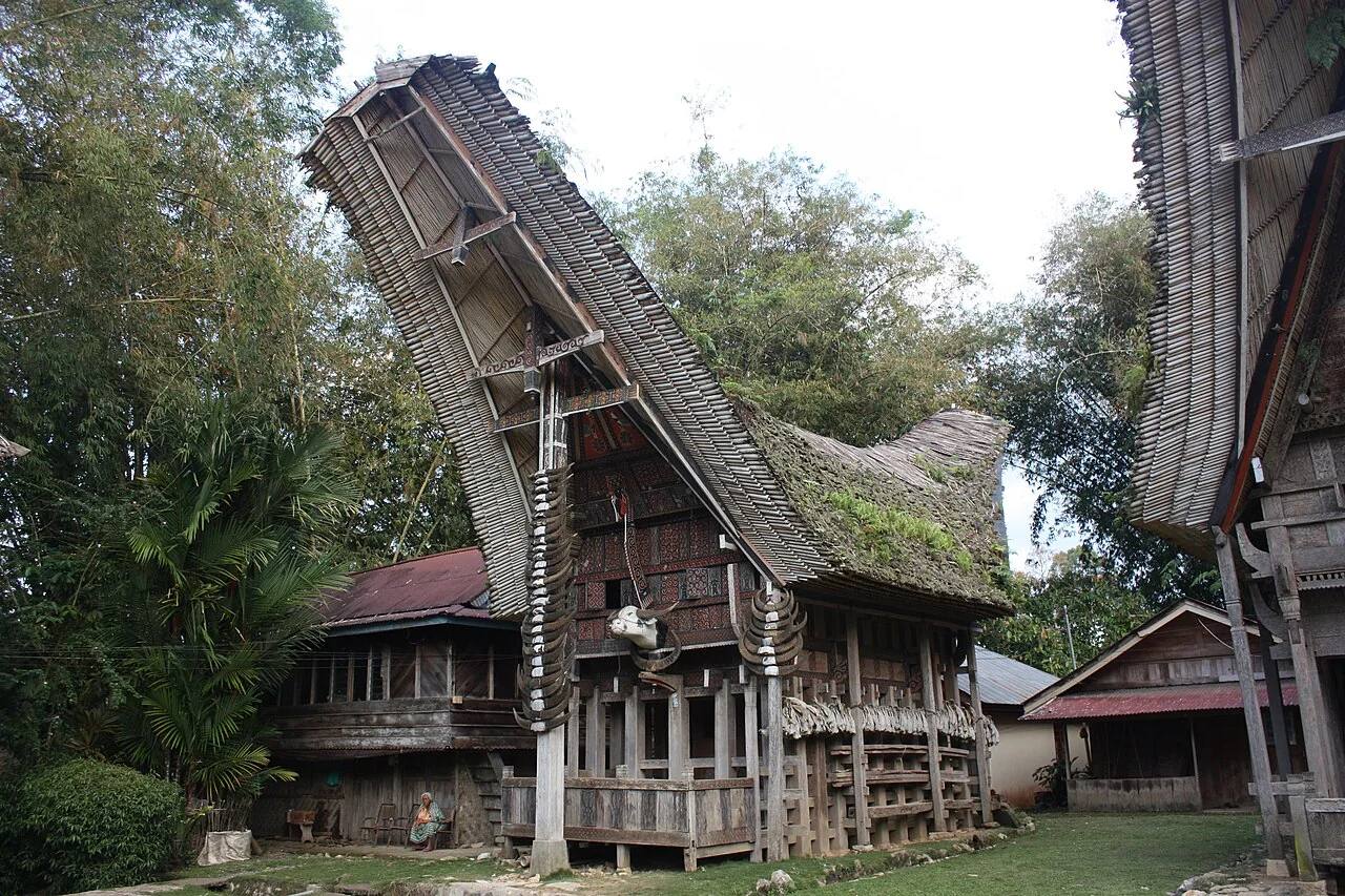 A carved tongkonan house at Kete Kesu with a steep sweeping roof
